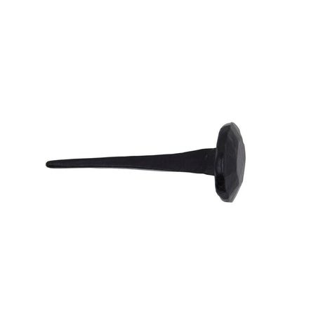 This is an image showing From The Anvil - Black 2" Handmade Nail available from T.H Wiggans Architectural Ironmongery in Kendal, quick delivery and discounted prices