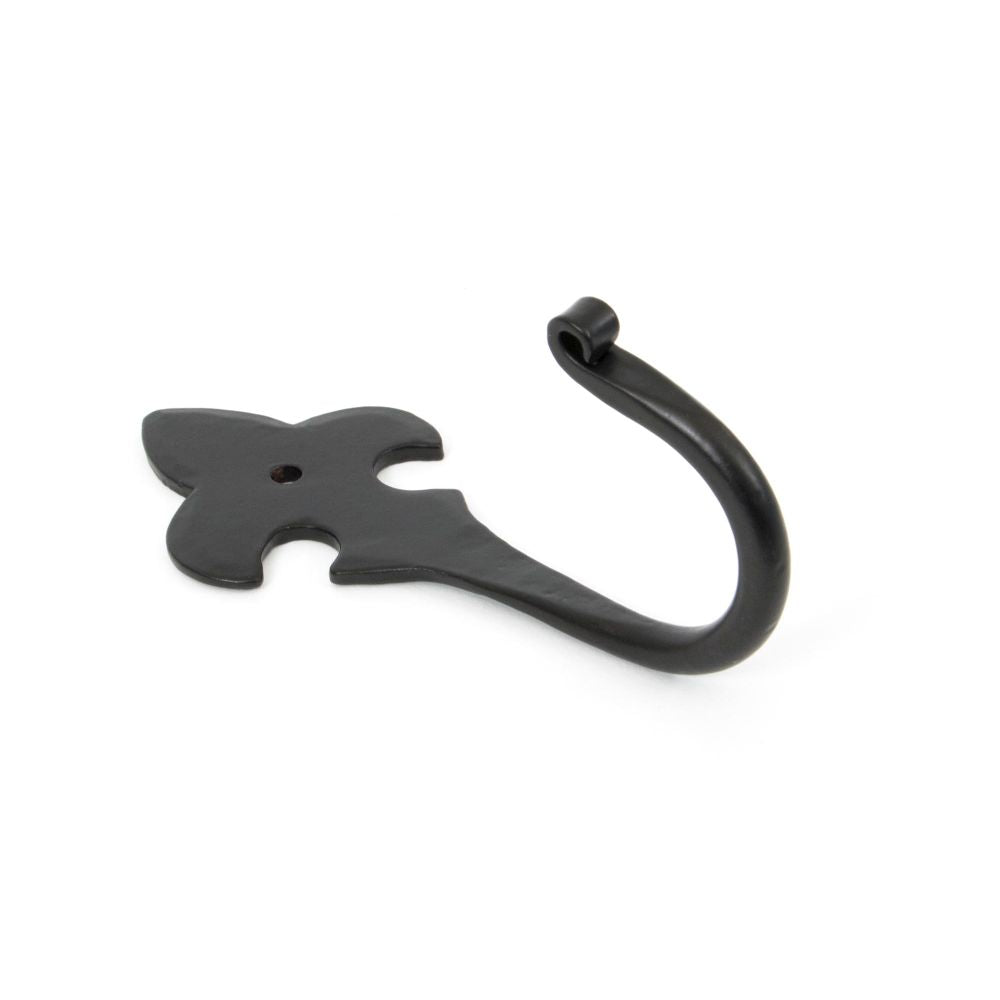 This is an image showing From The Anvil - Black Fleur-De-Lys Coat Hook available from T.H Wiggans Architectural Ironmongery in Kendal, quick delivery and discounted prices