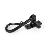 This is an image showing From The Anvil - Black Shepherd's Crook Fastener available from T.H Wiggans Architectural Ironmongery in Kendal, quick delivery and discounted prices