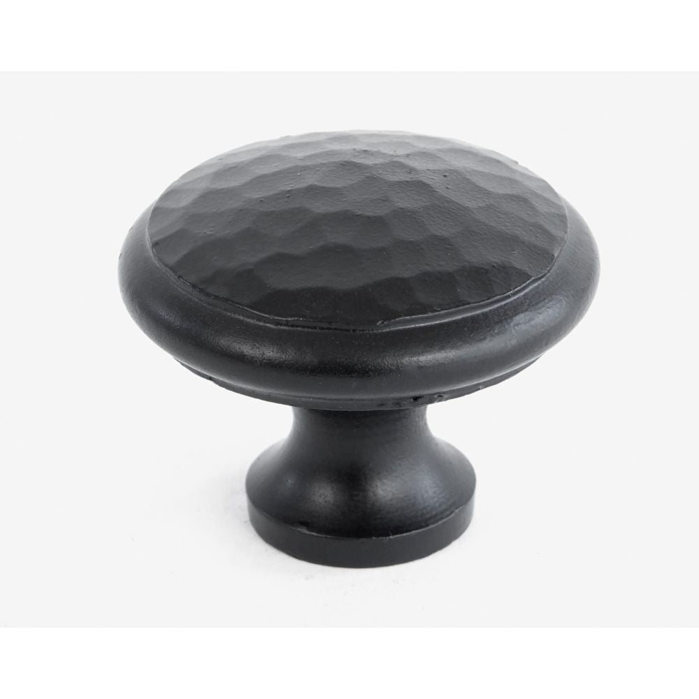 This is an image showing From The Anvil - Black Hammered Cabinet Knob - Large available from T.H Wiggans Architectural Ironmongery in Kendal, quick delivery and discounted prices