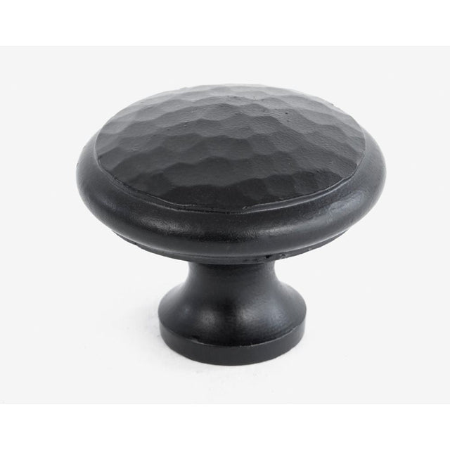 This is an image showing From The Anvil - Black Hammered Cabinet Knob - Large available from T.H Wiggans Architectural Ironmongery in Kendal, quick delivery and discounted prices