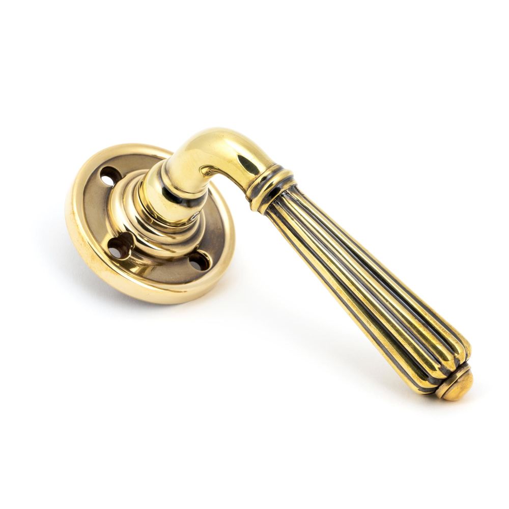 This is an image of From The Anvil - Aged Brass Hinton Lever on Rose Set available to order from T.H Wiggans Architectural Ironmongery in Kendal, quick delivery and discounted prices.