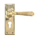 This is an image of From The Anvil - Aged Brass Hinton Lever Euro Lock Set available to order from T.H Wiggans Architectural Ironmongery in Kendal, quick delivery and discounted prices.