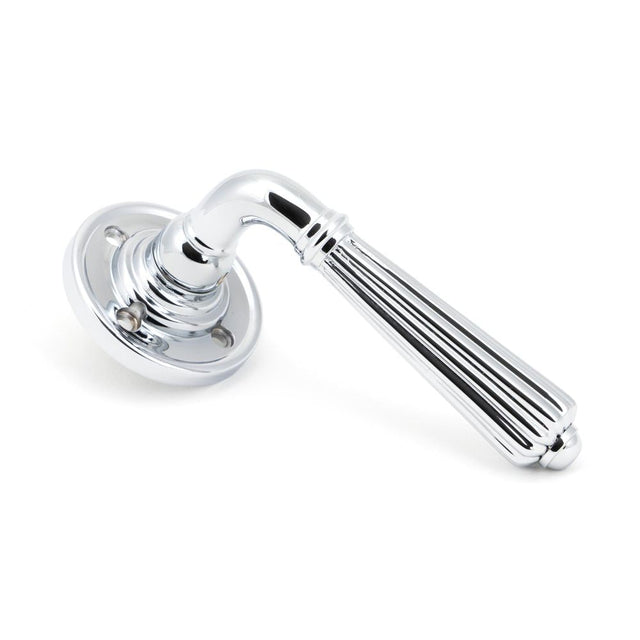 This is an image of From The Anvil - Polished Chrome Hinton Lever on Rose Set available to order from T.H Wiggans Architectural Ironmongery in Kendal, quick delivery and discounted prices.