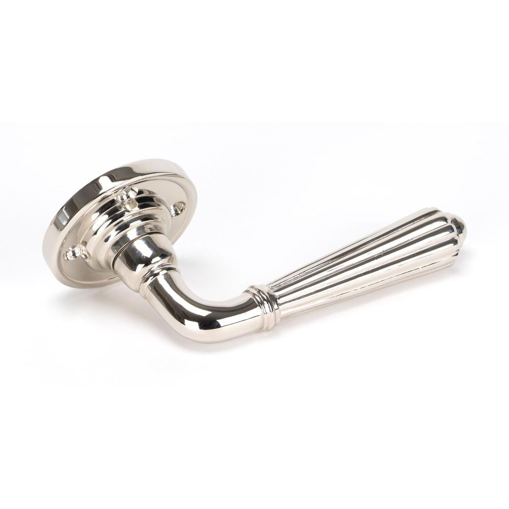 This is an image showing From The Anvil - Polished Nickel Hinton Lever on Rose Set available from trade door handles, quick delivery and discounted prices