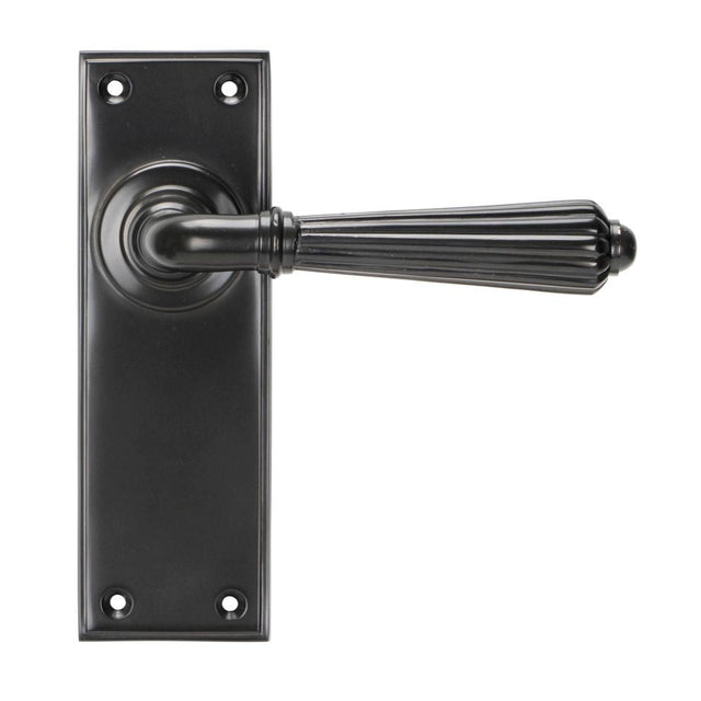 This is an image of From The Anvil - Aged Bronze Hinton Lever Latch Set available to order from T.H Wiggans Architectural Ironmongery in Kendal, quick delivery and discounted prices.