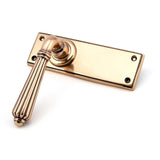 This is an image showing From The Anvil - Polished Bronze Hinton Lever Latch Set available from trade door handles, quick delivery and discounted prices