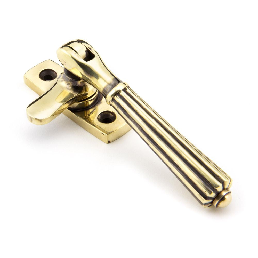 This is an image showing From The Anvil - Aged Brass Locking Hinton Fastener available from T.H Wiggans Architectural Ironmongery in Kendal, quick delivery and discounted prices