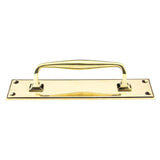 This is an image showing From The Anvil - Aged Brass 300mm Art Deco Pull Handle on Backplate available from trade door handles, quick delivery and discounted prices