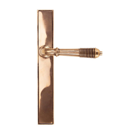 This is an image showing From The Anvil - Polished Bronze Reeded Slimline Lever Latch Set available from trade door handles, quick delivery and discounted prices