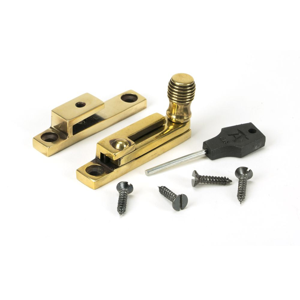 This is an image showing From The Anvil - Aged Brass Beehive Quadrant Fastener - Narrow available from T.H Wiggans Architectural Ironmongery in Kendal, quick delivery and discounted prices