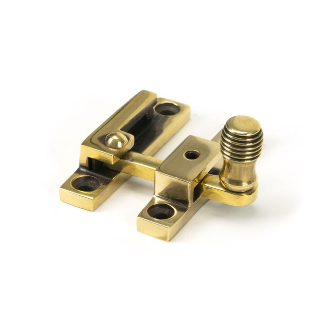 This is an image showing From The Anvil - Aged Brass Beehive Quadrant Fastener - Narrow available from T.H Wiggans Architectural Ironmongery in Kendal, quick delivery and discounted prices