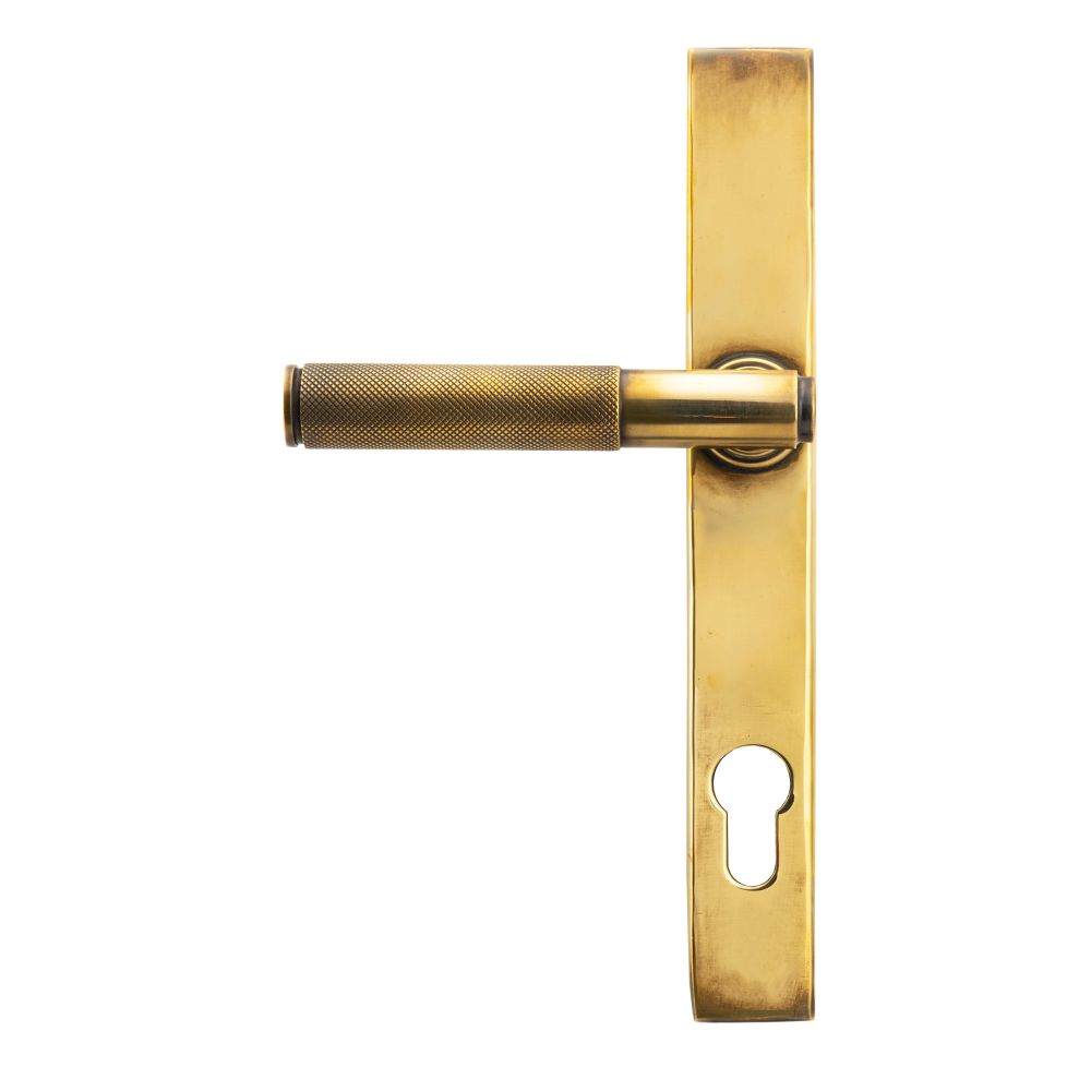 This is an image showing From The Anvil - Aged Brass Brompton Slimline Lever Espag. Lock Set available from trade door handles, quick delivery and discounted prices