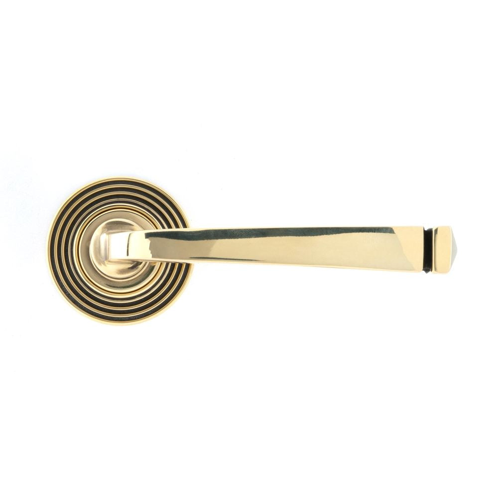 This is an image showing From The Anvil - Aged Brass Avon Round Lever on Rose Set (Beehive) available from trade door handles, quick delivery and discounted prices