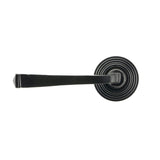 This is an image showing From The Anvil - Black Avon Round Lever on Rose Set (Beehive) available from trade door handles, quick delivery and discounted prices