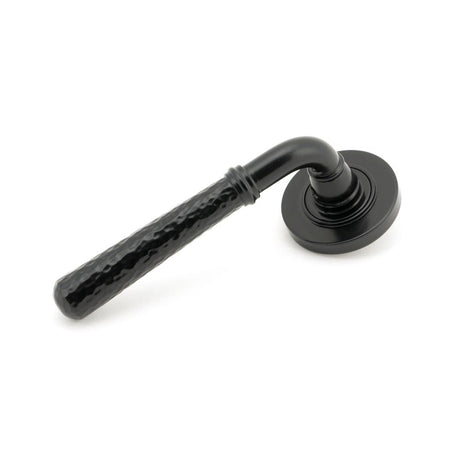 This is an image of From The Anvil - Black Hammered Newbury Lever on Rose Set (Plain) available to order from T.H Wiggans Architectural Ironmongery in Kendal, quick delivery and discounted prices.