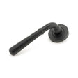 This is an image of From The Anvil - Matt Black Hammered Newbury Lever on Rose Set (Plain) available to order from T.H Wiggans Architectural Ironmongery in Kendal, quick delivery and discounted prices.