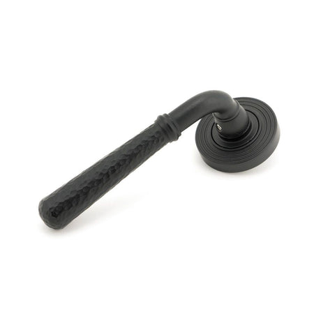 This is an image of From The Anvil - Matt Black Hammered Newbury Lever on Rose Set (Beehive) available to order from T.H Wiggans Architectural Ironmongery in Kendal, quick delivery and discounted prices.