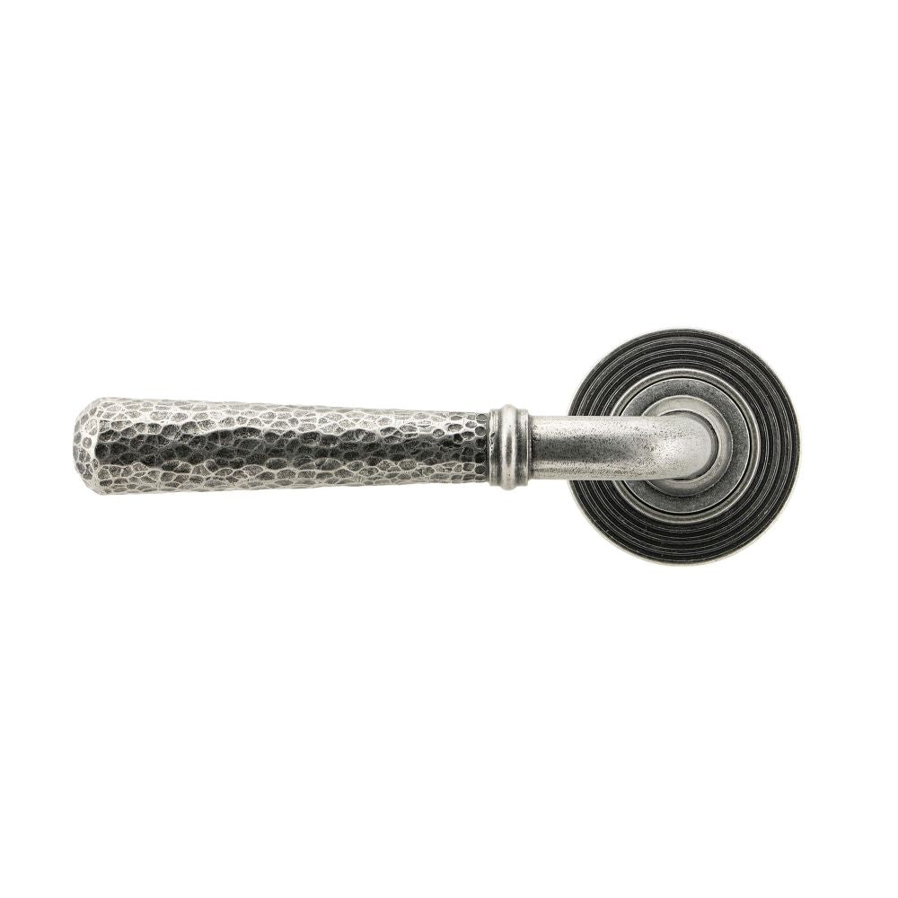 This is an image showing From The Anvil - Pewter Hammered Newbury Lever on Rose Set (Beehive) available from trade door handles, quick delivery and discounted prices