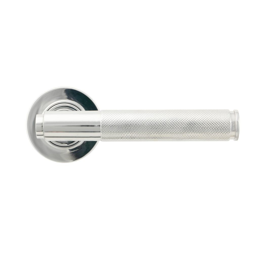 This is an image showing From The Anvil - Polished Chrome Brompton Lever on Rose Set (Plain) available from trade door handles, quick delivery and discounted prices