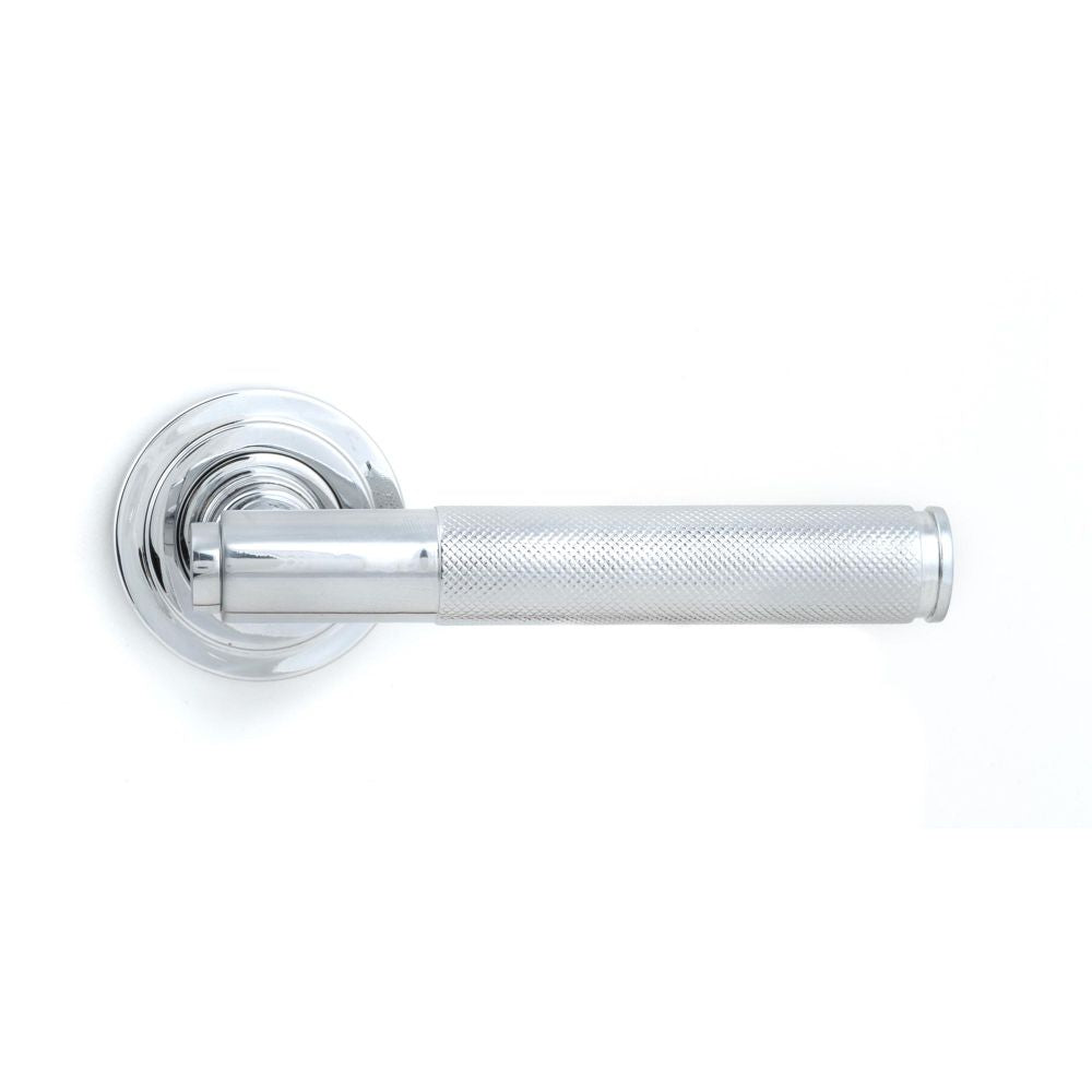 This is an image showing From The Anvil - Polished Chrome Brompton Lever on Rose Set (Art Deco) available from trade door handles, quick delivery and discounted prices