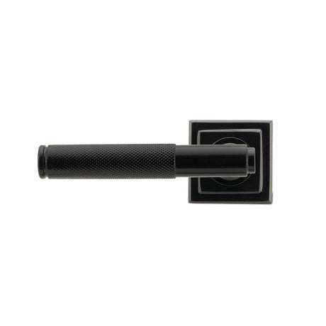 This is an image showing From The Anvil - Black Brompton Lever on Rose Set (Square) available from trade door handles, quick delivery and discounted prices