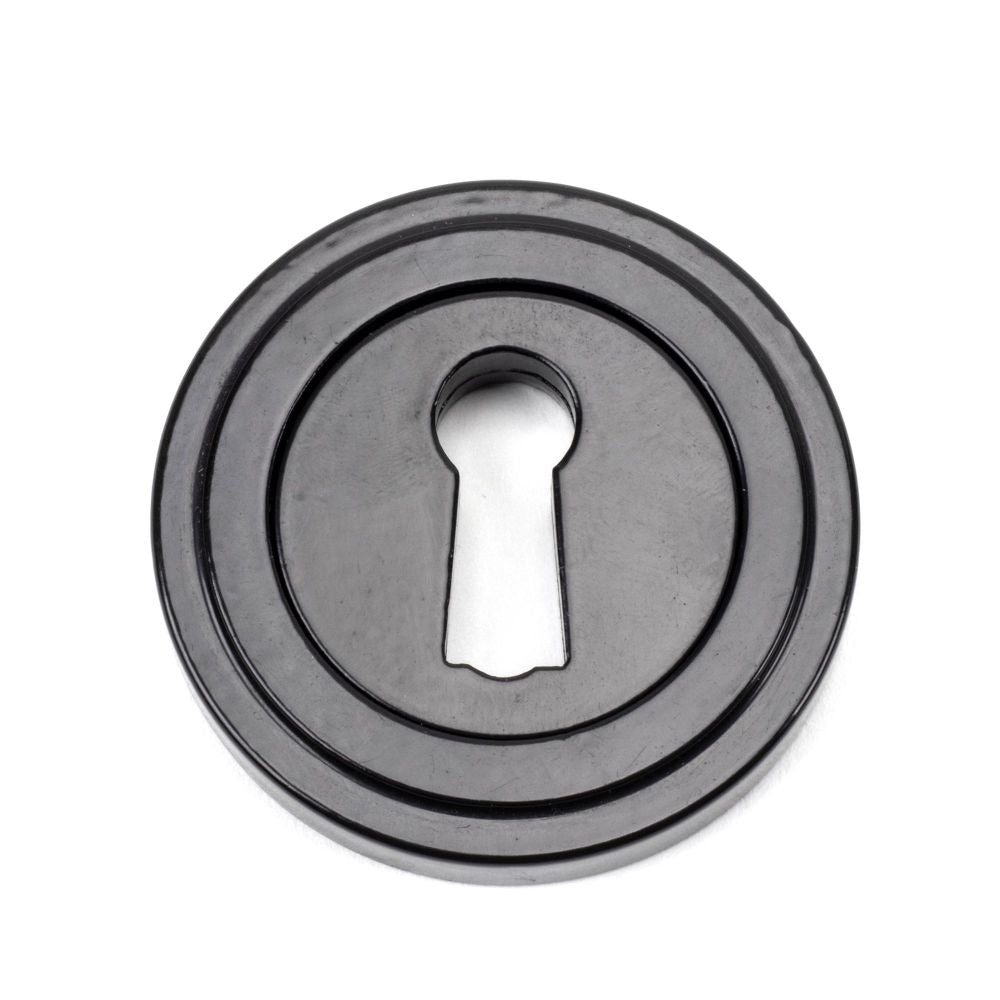 This is an image of From The Anvil - Black Round Escutcheon (Art Deco) available to order from T.H Wiggans Architectural Ironmongery in Kendal, quick delivery and discounted prices.