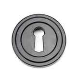 This is an image of From The Anvil - Black Round Escutcheon (Art Deco) available to order from T.H Wiggans Architectural Ironmongery in Kendal, quick delivery and discounted prices.