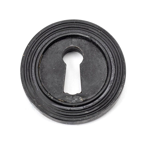 This is an image of From The Anvil - External Beeswax Round Escutcheon (Beehive) available to order from T.H Wiggans Architectural Ironmongery in Kendal, quick delivery and discounted prices.