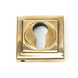 This is an image of From The Anvil - Aged Brass Round Euro Escutcheon (Square) available to order from T.H Wiggans Architectural Ironmongery in Kendal, quick delivery and discounted prices.