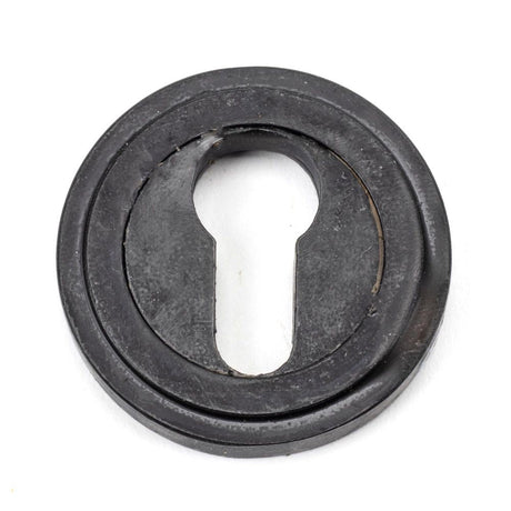 This is an image of From The Anvil - External Beeswax Round Euro Escutcheon (Art Deco) available to order from T.H Wiggans Architectural Ironmongery in Kendal, quick delivery and discounted prices.