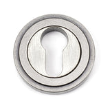 This is an image of From The Anvil - Pewter Round Euro Escutcheon (Art Deco) available to order from T.H Wiggans Architectural Ironmongery in Kendal, quick delivery and discounted prices.