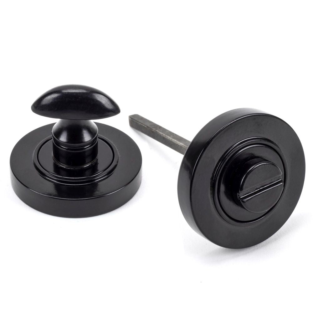 This is an image of From The Anvil - Black Round Thumbturn Set (Plain) available to order from T.H Wiggans Architectural Ironmongery in Kendal, quick delivery and discounted prices.