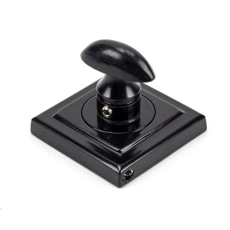 This is an image showing From The Anvil - Black Round Thumbturn Set (Square) available from trade door handles, quick delivery and discounted prices