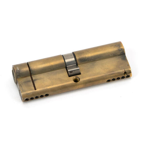 This is an image showing From The Anvil - Aged Brass 45/45 5pin Euro Cylinder available from T.H Wiggans Architectural Ironmongery in Kendal, quick delivery and discounted prices