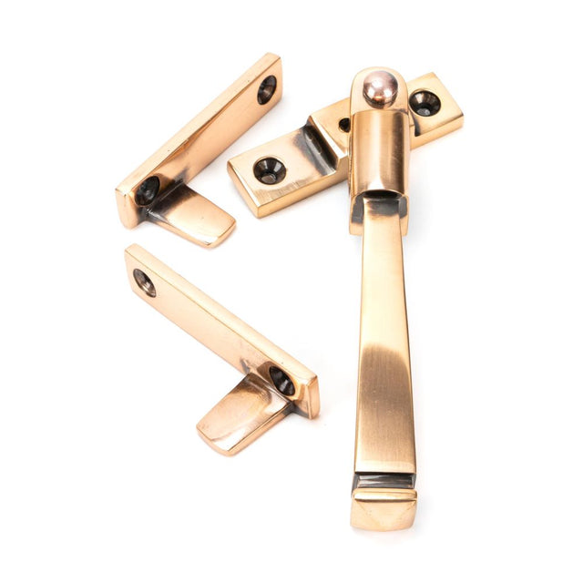 This is an image showing From The Anvil - Polished Bronze Night-Vent Locking Avon Fastener available from T.H Wiggans Architectural Ironmongery in Kendal, quick delivery and discounted prices