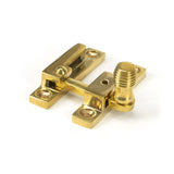 This is an image showing From The Anvil - Polished Brass Beehive Quadrant Fastener - Narrow available from T.H Wiggans Architectural Ironmongery in Kendal, quick delivery and discounted prices