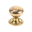 This is an image showing From The Anvil - Aged Brass Hammered Mushroom Cabinet Knob 32mm available from T.H Wiggans Architectural Ironmongery in Kendal, quick delivery and discounted prices