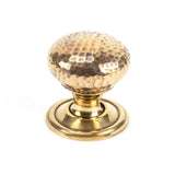 This is an image showing From The Anvil - Aged Brass Hammered Mushroom Cabinet Knob 32mm available from T.H Wiggans Architectural Ironmongery in Kendal, quick delivery and discounted prices