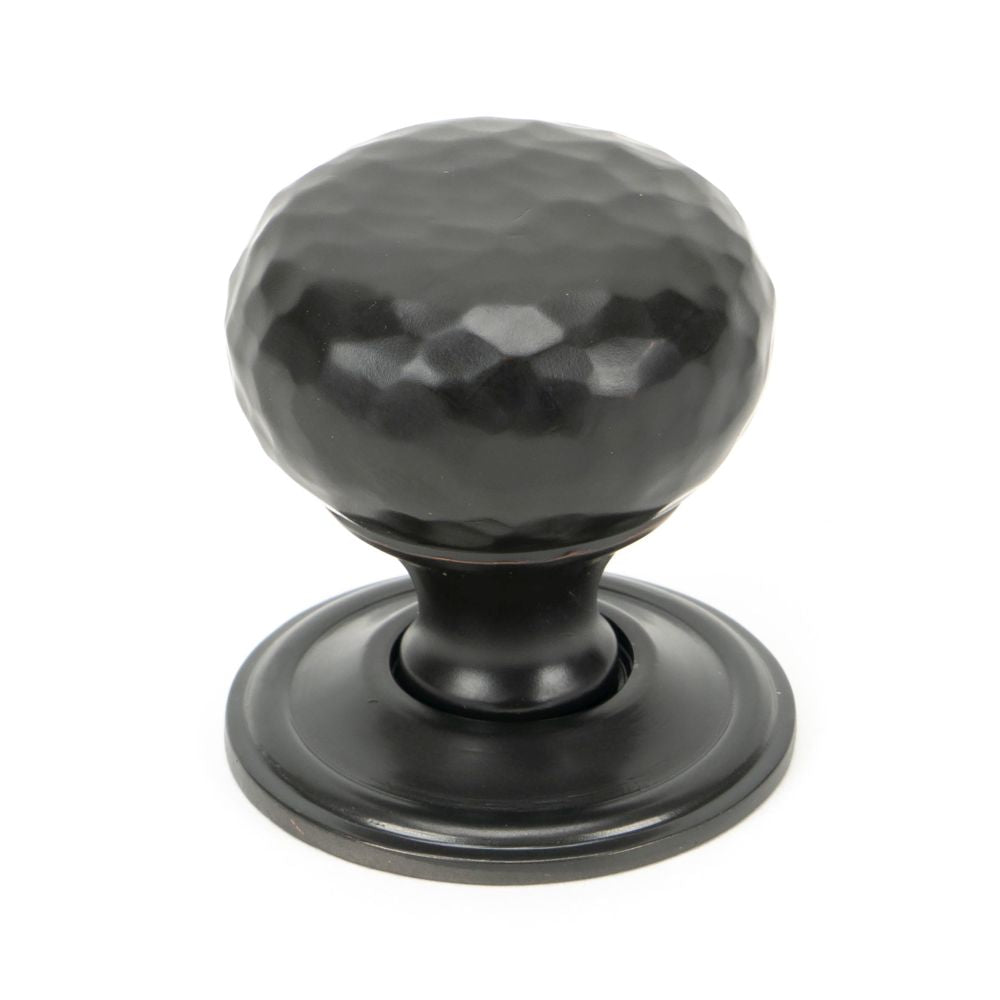This is an image showing From The Anvil - Aged Bronze Hammered Mushroom Cabinet Knob 32mm available from T.H Wiggans Architectural Ironmongery in Kendal, quick delivery and discounted prices