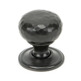 This is an image showing From The Anvil - Aged Bronze Hammered Mushroom Cabinet Knob 32mm available from T.H Wiggans Architectural Ironmongery in Kendal, quick delivery and discounted prices