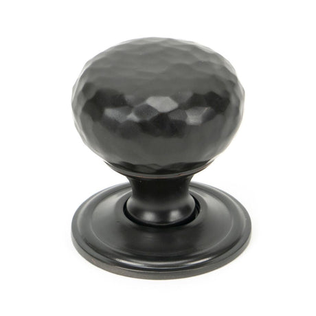 This is an image showing From The Anvil - Aged Bronze Hammered Mushroom Cabinet Knob 32mm available from T.H Wiggans Architectural Ironmongery in Kendal, quick delivery and discounted prices