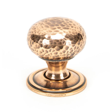 This is an image showing From The Anvil - Polished Bronze Hammered Mushroom Cabinet Knob 32mm available from T.H Wiggans Architectural Ironmongery in Kendal, quick delivery and discounted prices