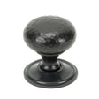 This is an image showing From The Anvil - Aged Bronze Hammered Mushroom Cabinet Knob 38mm available from T.H Wiggans Architectural Ironmongery in Kendal, quick delivery and discounted prices