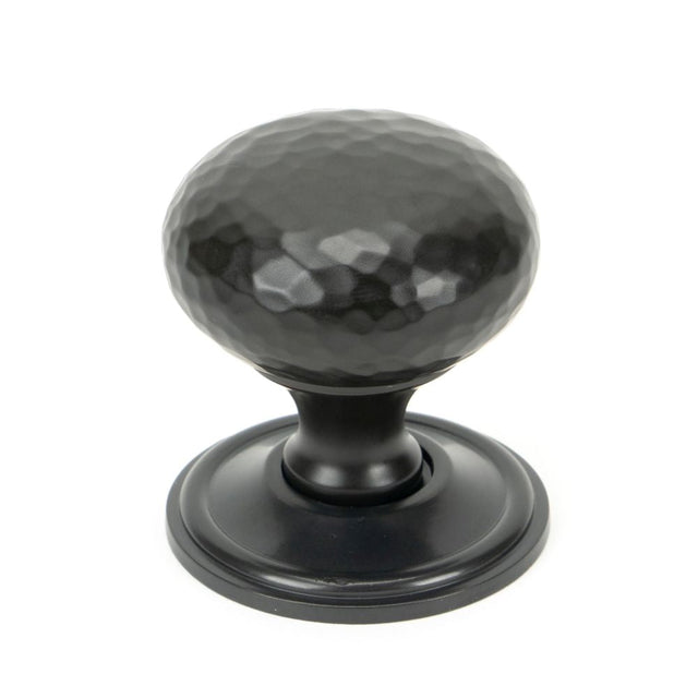 This is an image showing From The Anvil - Aged Bronze Hammered Mushroom Cabinet Knob 38mm available from T.H Wiggans Architectural Ironmongery in Kendal, quick delivery and discounted prices