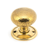 This is an image showing From The Anvil - Aged Brass Hammered Mushroom Mortice/Rim Knob Set available from trade door handles, quick delivery and discounted prices