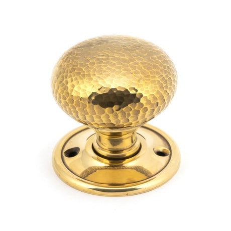 This is an image showing From The Anvil - Aged Brass Hammered Mushroom Mortice/Rim Knob Set available from trade door handles, quick delivery and discounted prices