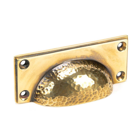 This is an image showing From The Anvil - Aged Brass Hammered Art Deco Drawer Pull available from T.H Wiggans Architectural Ironmongery in Kendal, quick delivery and discounted prices
