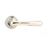 This is an image showing From The Anvil - Polished Nickel Newbury Lever on Rose Set (Plain) available from trade door handles, quick delivery and discounted prices