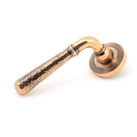 This is an image of From The Anvil - Polished Bronze Hammered Newbury Lever on Rose Set (Beehive) available to order from T.H Wiggans Architectural Ironmongery in Kendal, quick delivery and discounted prices.